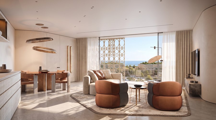 An open living and kitchen space with the sea beyond