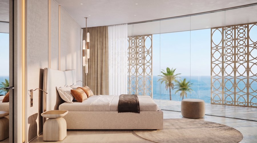 A bedroom with palms and the shoreline beyond